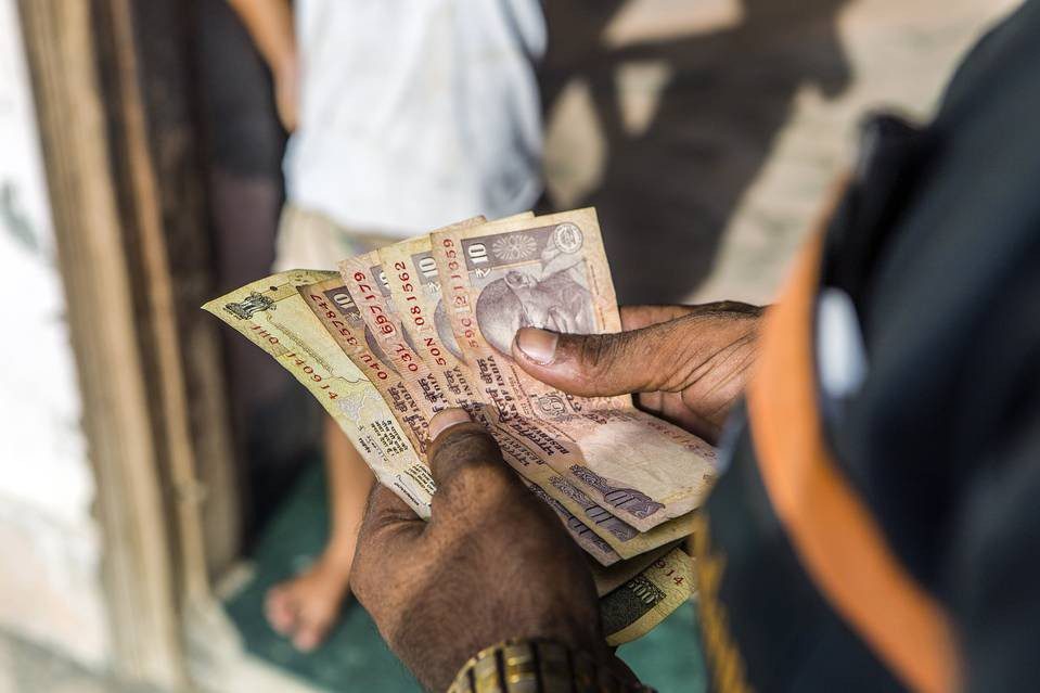 Image of multiple Rs 10 notes showing the dependency of cash