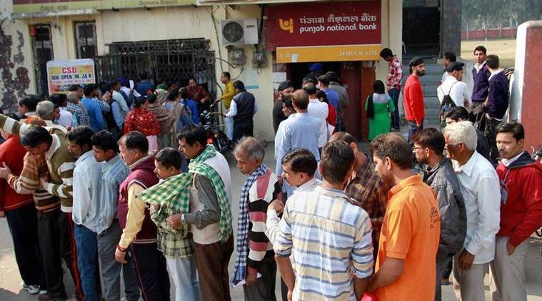 People standing in front of banks showing the dependency of traditional banking and need for cashless India