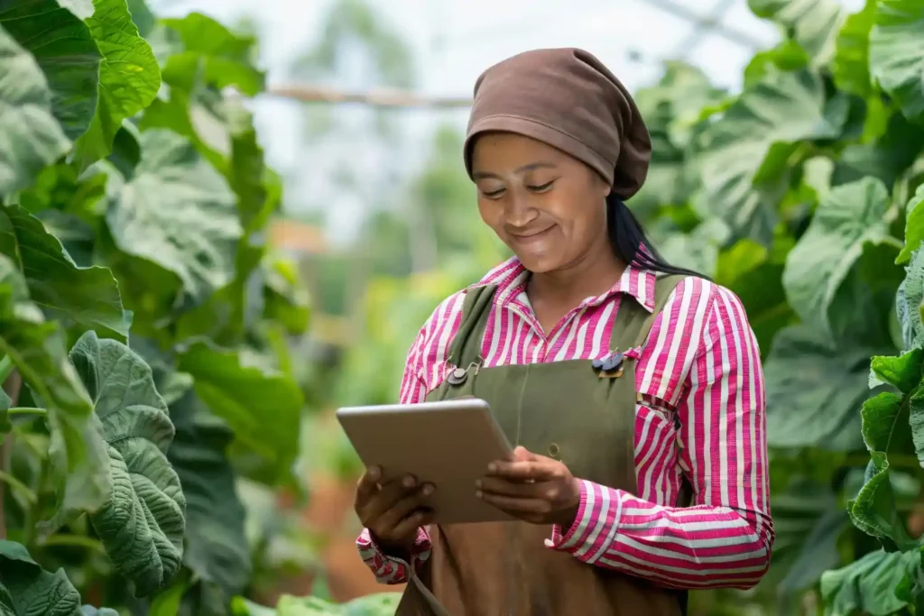 A farmer in India performing a cashless transaction.
