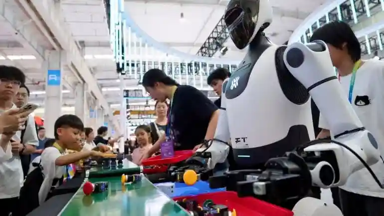 Humanoid robots demonstrate hands-on interaction at a public robotics exhibition.